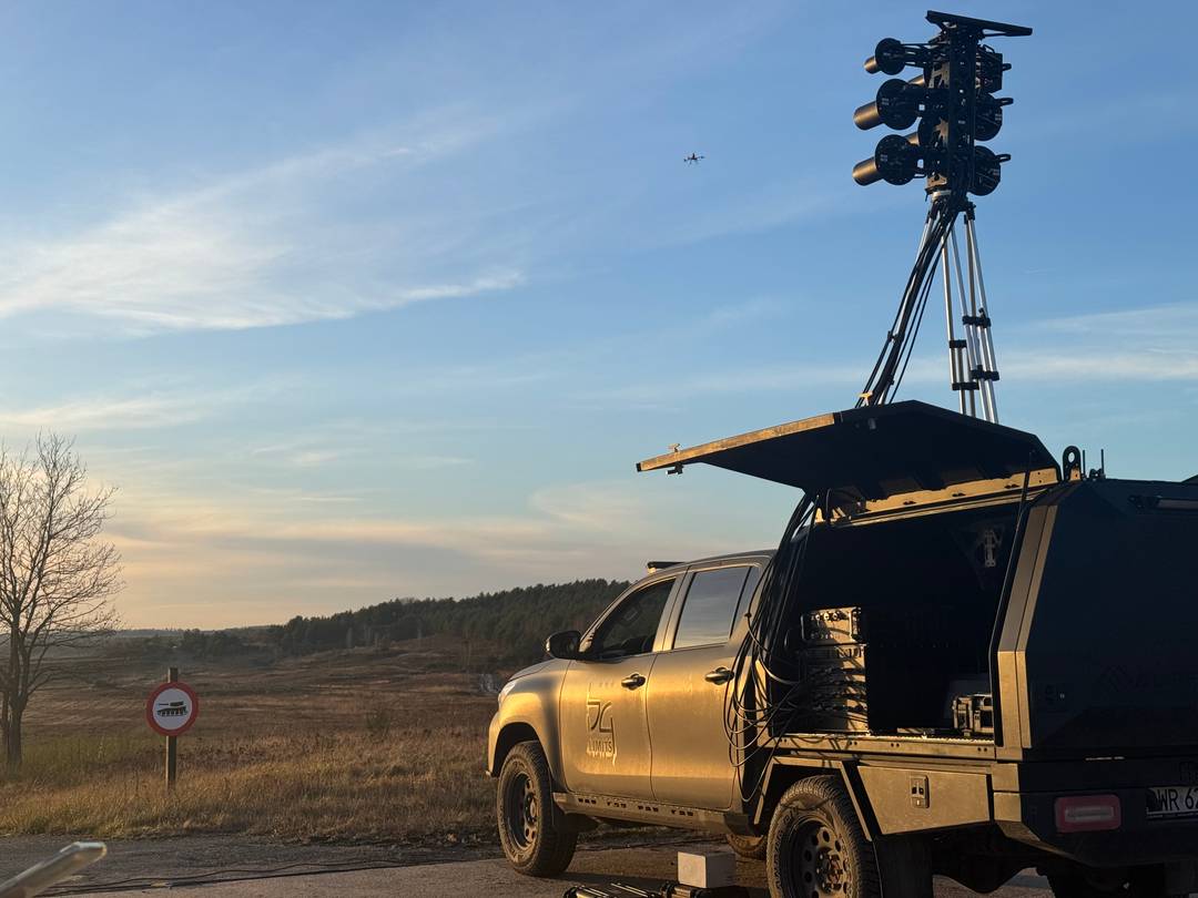 Defender reactive jamming system deployed on vehicle with directional antennas and mast — field operational configuration